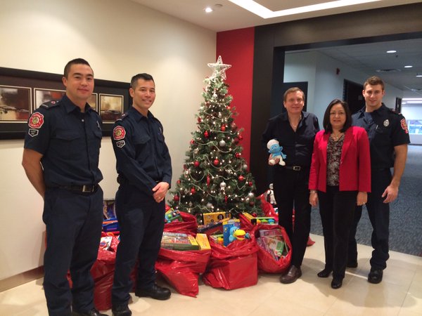 Firefighters pick up toys